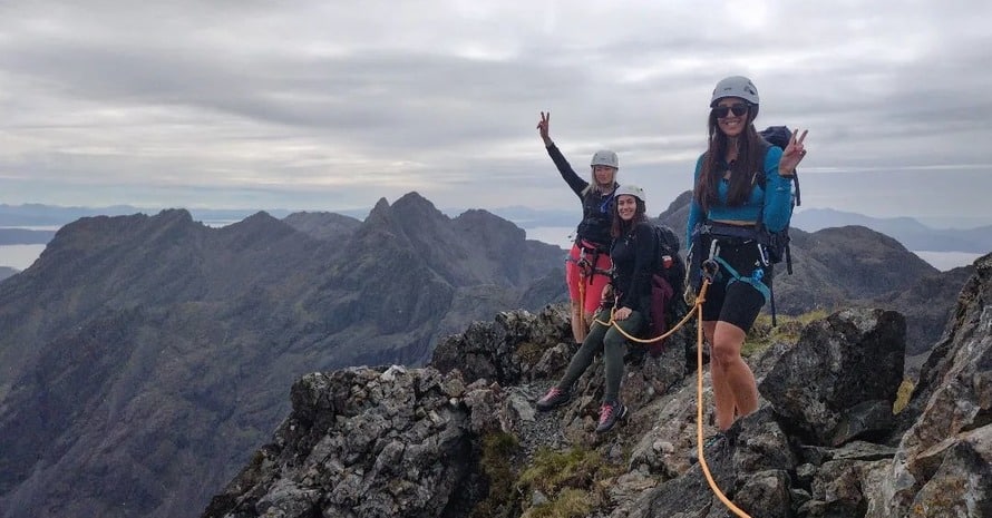 Three Women Posing For PhotoWhile Climbing